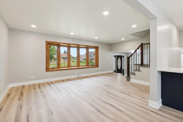 919 E Cooper Dr, Palatine, IL 60074 - unfurnished living room featuring light wood finished floors, stairs, and recessed lighting