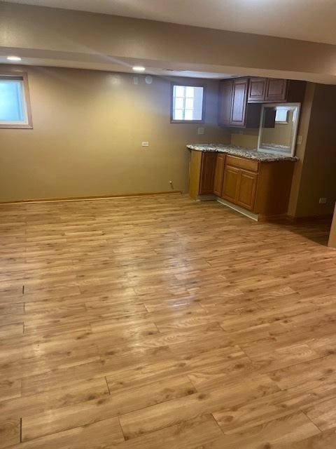 6111 S Menard Ave, Chicago, IL 60638 - kitchen with light wood finished floors and brown cabinetry