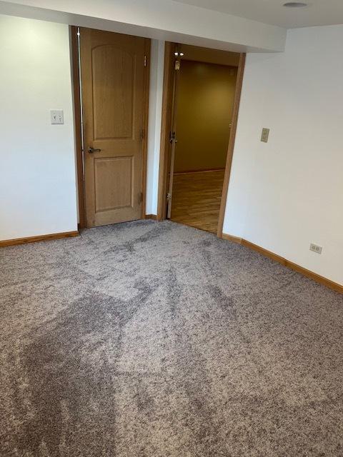 6111 S Menard Ave, Chicago, IL 60638 - spare room featuring carpet and baseboards