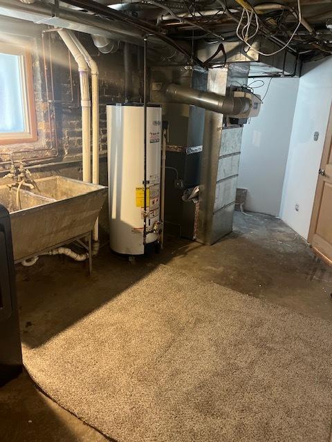 6111 S Menard Ave, Chicago, IL 60638 - unfinished below grade area featuring water heater and a sink