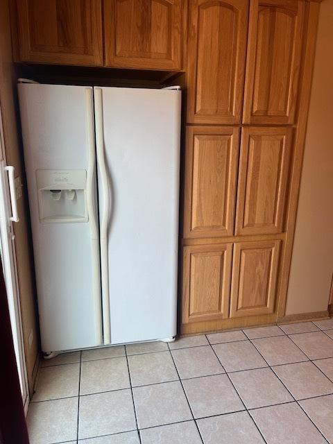 6111 S Menard Ave, Chicago, IL 60638 - laundry area with light tile patterned floors