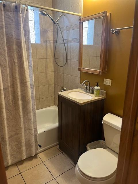 6111 S Menard Ave, Chicago, IL 60638 - full bathroom with toilet, shower / tub combo, tile patterned floors, and vanity