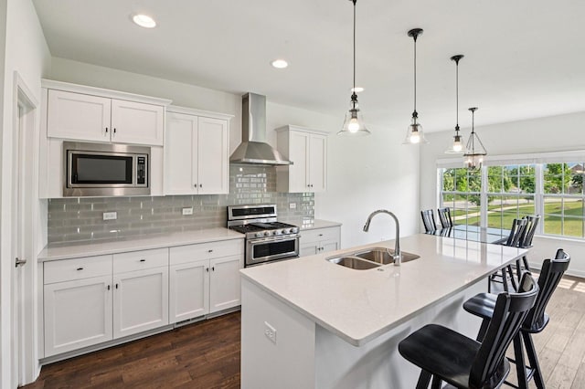 1518 128th St, Lemont, IL 60439 - kitchen featuring wall chimney range hood, stainless steel appliances, dark wood-style floors, tasteful backsplash, and light countertops