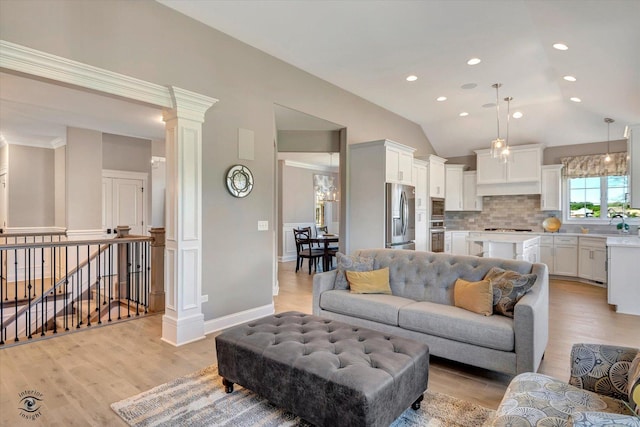 8830 Indiana Harbor Dr, Frankfort, IL 60423 - living room with light wood finished floors, lofted ceiling, recessed lighting, baseboards, and decorative columns