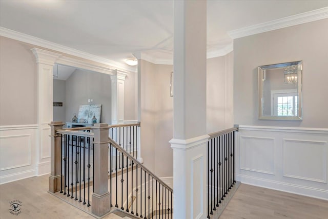 8830 Indiana Harbor Dr, Frankfort, IL 60423 - corridor featuring an upstairs landing, a decorative wall, wood finished floors, ornamental molding, and wainscoting