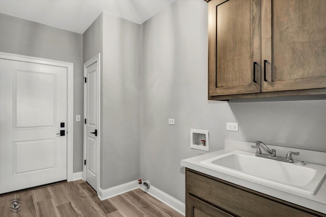 8830 Indiana Harbor Dr, Frankfort, IL 60423 - washroom with hookup for a washing machine, cabinet space, light wood-type flooring, and baseboards