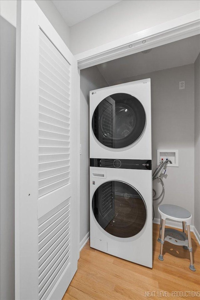 1614 Orth Dr, Wheaton, IL 60189 - washroom featuring stacked washer / drying machine and wood finished floors