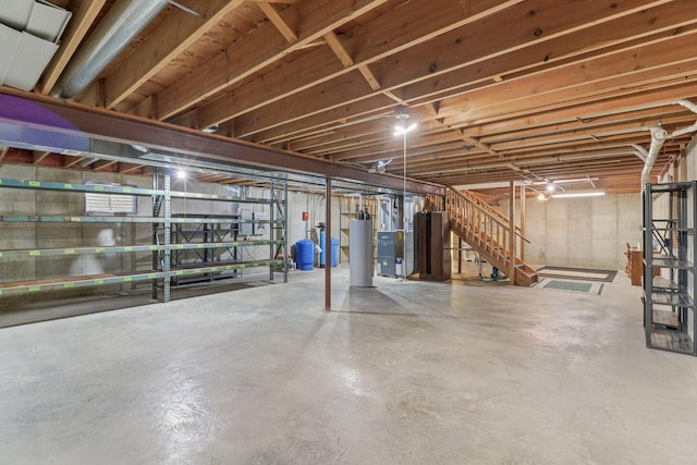 35932 N Watson Ave, Ingleside, IL 60041 - unfinished basement with a water pressure tank, stairway, and water heater