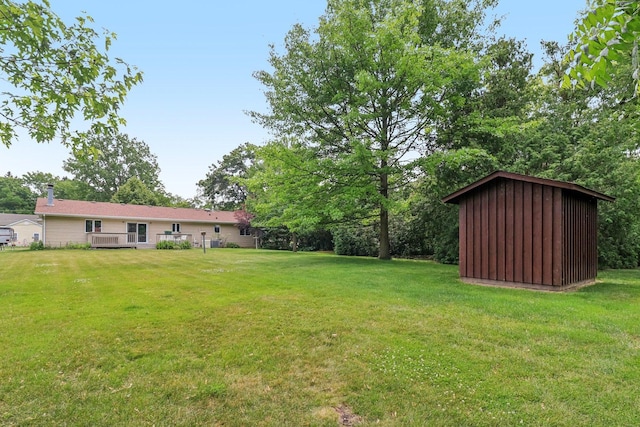35932 N Watson Ave, Ingleside, IL 60041 - view of green lawn with a storage shed and a deck