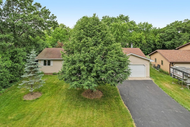 35932 N Watson Ave, Ingleside, IL 60041 - view of front of property featuring a garage and a front yard