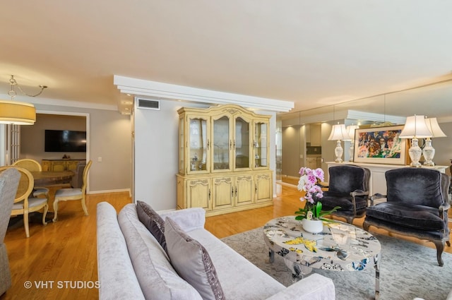 110 E Delaware Pl Unit 1501, Chicago, IL 60611 - living area featuring crown molding and light wood-style flooring