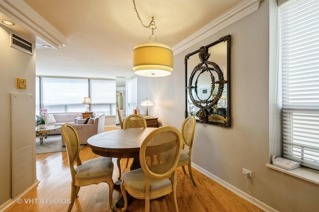 110 E Delaware Pl Unit 1501, Chicago, IL 60611 - dining room with light wood-type flooring and ornamental molding