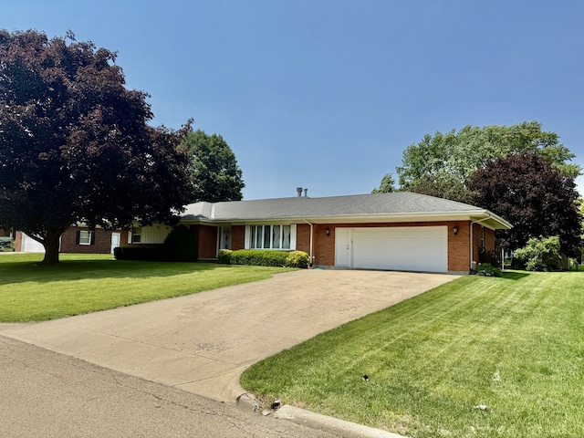 1704 Lakewood Dr, Mendota, IL 61342 - ranch-style home with a garage, a front lawn, driveway, and brick siding