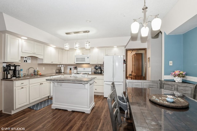 1233 Timber Pl, New Lenox, IL 60451 - kitchen featuring white appliances, dark wood-style flooring, white cabinetry, a kitchen island, and a chandelier