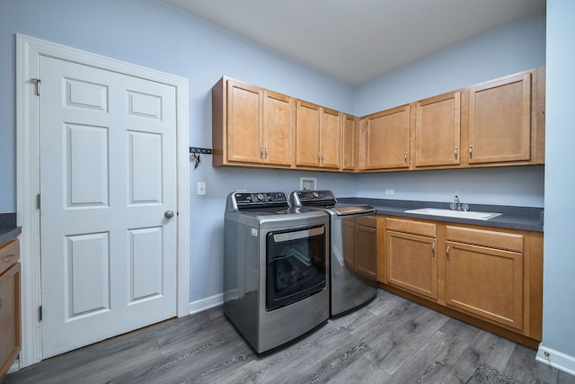 3095 Long Common Pkwy, Elgin, IL 60124 - laundry area featuring washer and dryer, wood finished floors, and cabinet space
