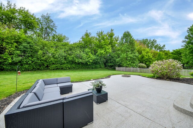 3095 Long Common Pkwy, Elgin, IL 60124 - view of patio with an outdoor living space with a fire pit and view of wooded area