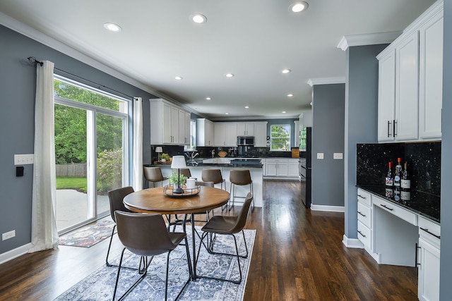 3095 Long Common Pkwy, Elgin, IL 60124 - dining area featuring crown molding, dark wood-type flooring, recessed lighting, and a bar