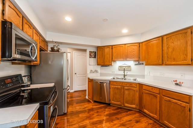 75 Willow Pkwy, Buffalo Grove, IL 60089 - kitchen with appliances with stainless steel finishes, dark wood-style floors, light countertops, brown cabinets, and recessed lighting