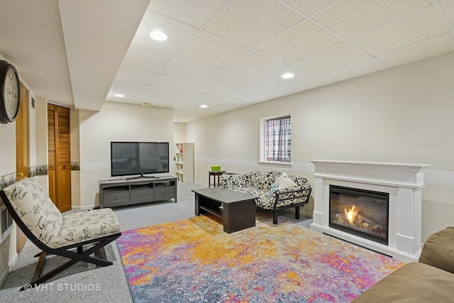4643 Rolling Hills Dr, Lake In The Hills, IL 60156 - living area featuring carpet, a paneled ceiling, recessed lighting, and a glass covered fireplace
