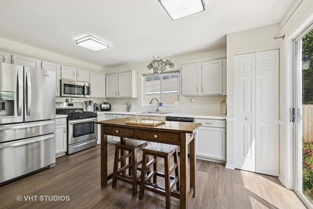 4643 Rolling Hills Dr, Lake In The Hills, IL 60156 - kitchen with appliances with stainless steel finishes, light countertops, and dark wood-type flooring