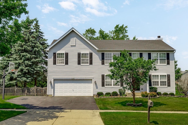 1216 Barlina Rd, Crystal Lake, IL 60014 - view of front facade with driveway, an attached garage, and a chimney