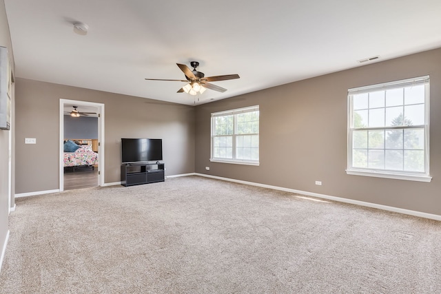 1216 Barlina Rd, Crystal Lake, IL 60014 - unfurnished living room featuring a ceiling fan and carpet floors