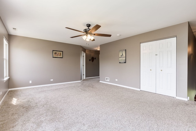 1216 Barlina Rd, Crystal Lake, IL 60014 - unfurnished bedroom with carpet, a closet, and ceiling fan