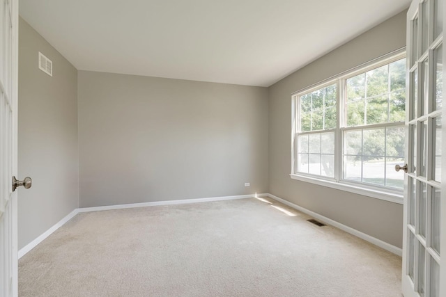1216 Barlina Rd, Crystal Lake, IL 60014 - spare room with baseboards and light carpet