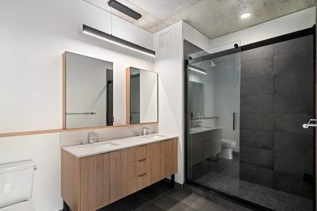 234 W Polk St Unit 3809, Chicago, IL 60607 - bathroom featuring double vanity, a stall shower, and tile patterned floors