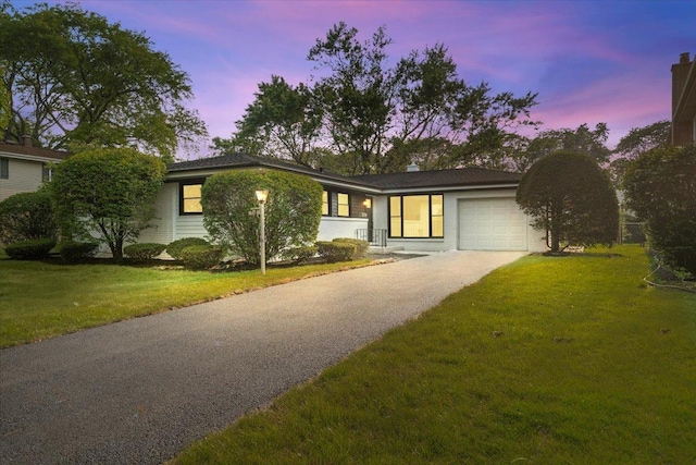 114 S Waverly Pl, Mount Prospect, IL 60056 - view of front of home with driveway, an attached garage, and a front yard