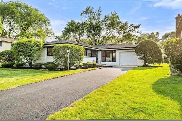114 S Waverly Pl, Mount Prospect, IL 60056 - view of front of property with an attached garage, asphalt driveway, and a front lawn