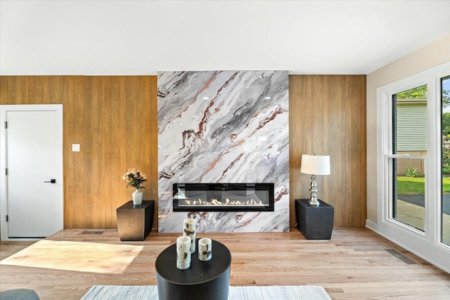 114 S Waverly Pl, Mount Prospect, IL 60056 - living area with wood walls, wood finished floors, and a fireplace