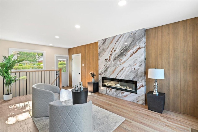114 S Waverly Pl, Mount Prospect, IL 60056 - living area with wooden walls, a fireplace, recessed lighting, and wood finished floors