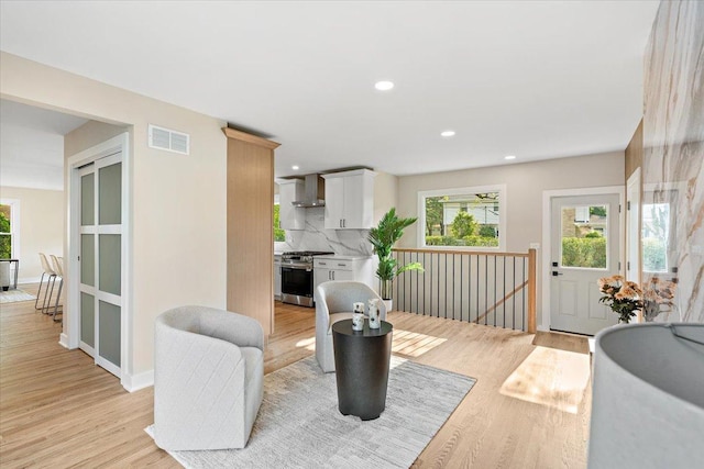 114 S Waverly Pl, Mount Prospect, IL 60056 - living room with healthy amount of natural light, light wood-style floors, and recessed lighting