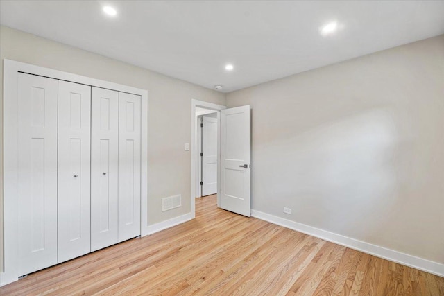 114 S Waverly Pl, Mount Prospect, IL 60056 - unfurnished bedroom featuring wood finished floors, recessed lighting, and a closet