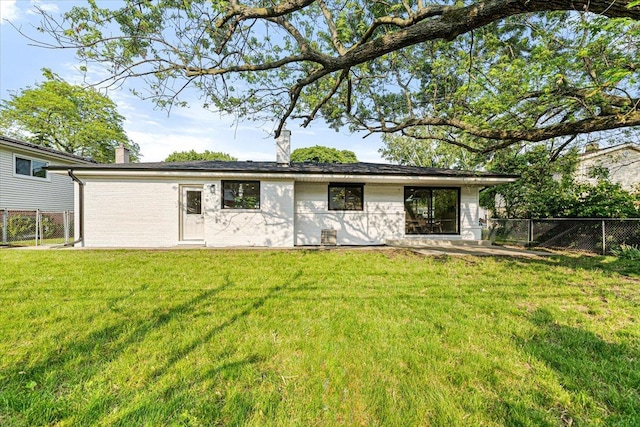 114 S Waverly Pl, Mount Prospect, IL 60056 - rear view of property featuring a chimney