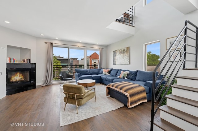 1645 W Erie St Unit 2, Chicago, IL 60622 - living area with a warm lit fireplace, stairs, wood finished floors, and recessed lighting