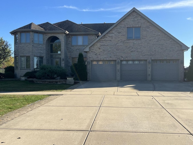 4429 203rd St, Matteson, IL 60443 - traditional home featuring brick siding, driveway, and a garage