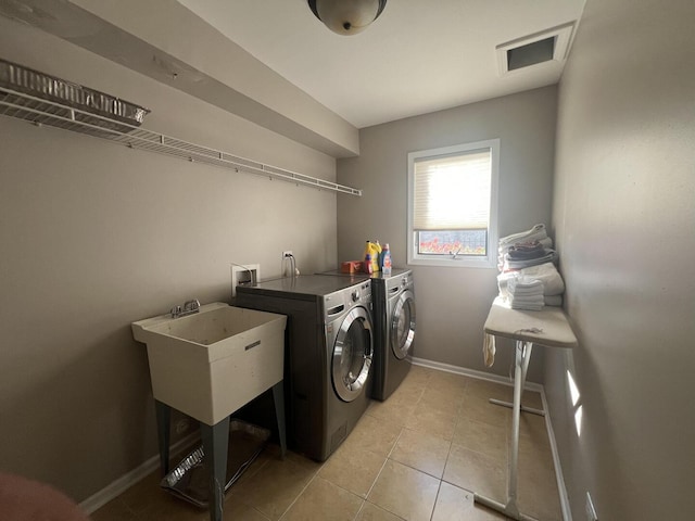 4429 203rd St, Matteson, IL 60443 - laundry room featuring washer and dryer, baseboards, and light tile patterned flooring