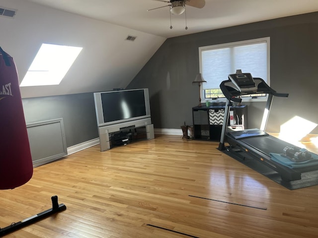 4429 203rd St, Matteson, IL 60443 - exercise area featuring wood finished floors, ceiling fan, lofted ceiling, a skylight, and baseboards