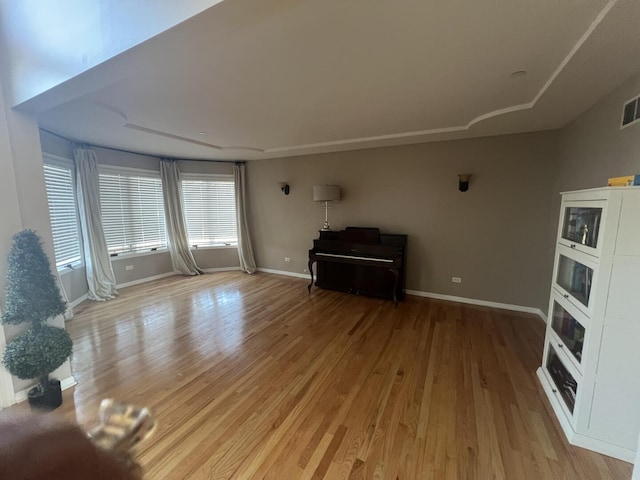 4429 203rd St, Matteson, IL 60443 - unfurnished living room with light wood finished floors and baseboards