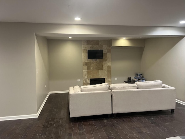 4429 203rd St, Matteson, IL 60443 - living area featuring dark wood-style flooring, baseboards, a tile fireplace, and recessed lighting