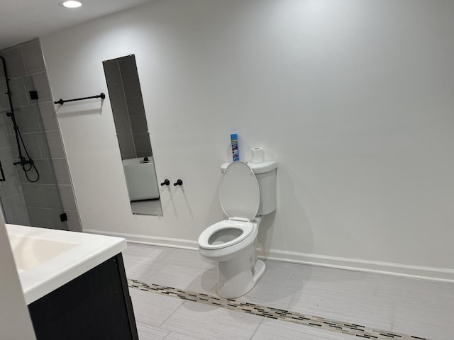 4429 203rd St, Matteson, IL 60443 - bathroom with toilet, vanity, baseboards, a tile shower, and recessed lighting