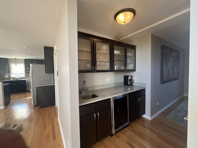 4429 203rd St, Matteson, IL 60443 - indoor wet bar featuring light wood-type flooring, baseboards, and wine cooler