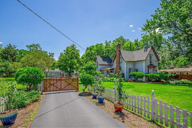 275 S Mchenry Ave, Crystal Lake, IL 60014 - view of front of home with a gate and a chimney