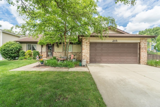 215 Chase Ct, Bolingbrook, IL 60440 - view of front of house featuring a garage, driveway, a front yard, and brick siding