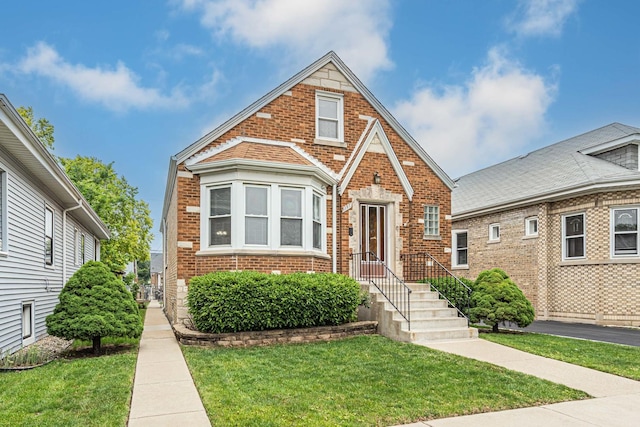 3134 N New England Ave, Chicago, IL 60634 - view of front facade featuring brick siding and a front lawn