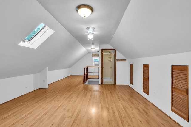 3134 N New England Ave, Chicago, IL 60634 - bonus room with light wood-style flooring, a skylight, lofted ceiling, and ceiling fan