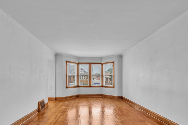 3134 N New England Ave, Chicago, IL 60634 - unfurnished room featuring light wood-style flooring and ornamental molding