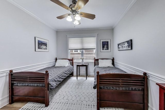 5021 N Kenmore Ave Unit 1S, Chicago, IL 60640 - bedroom featuring crown molding, wainscoting, and ceiling fan